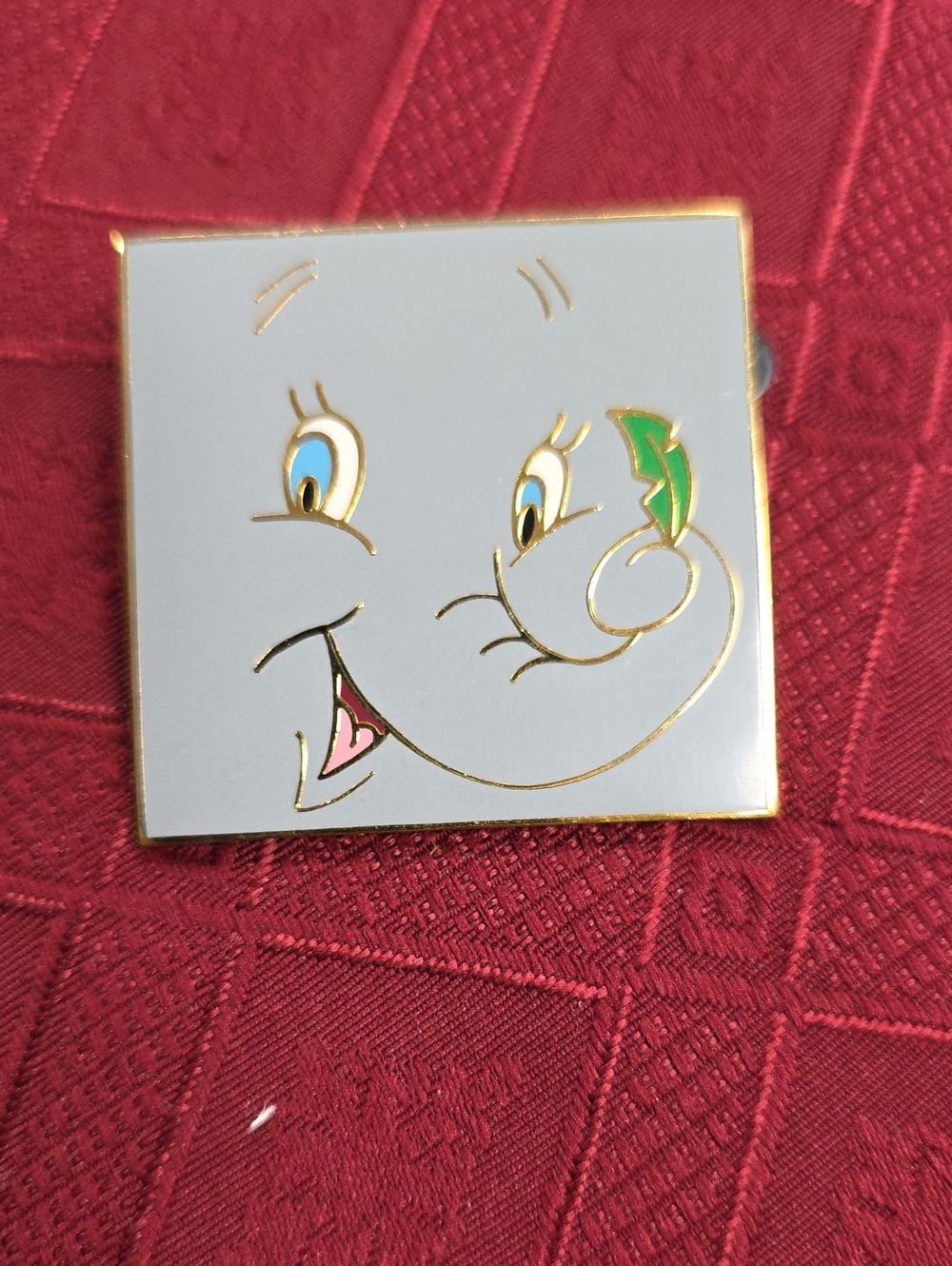 Disney White Cartoon Face Pin with Blue Eyes and Green Accent